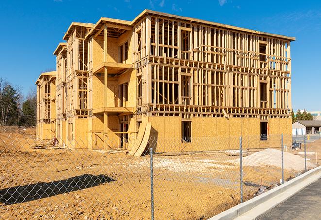 construction zone secured with a temporary fence, marked with warning signs in Gretna NE